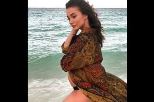 Watch video: Amy Jackson flaunts her baby bump at the beach