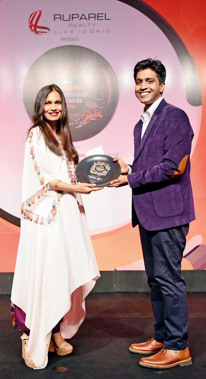 Maria Goretti gives the Best New Takeaway award to Ashwin Ramachandran of Milliways – Broth Noodle & Bao