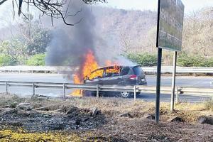 Watch video: Moving car catches fire on Mumbai-Pune expressway