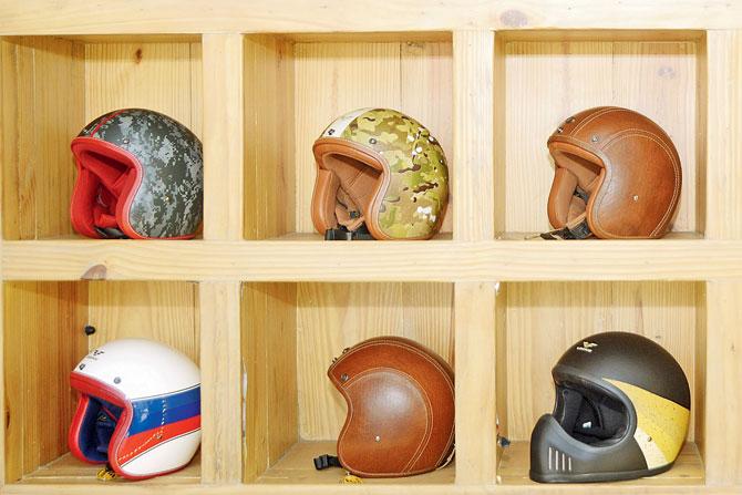 A shelf in the store with biking helmets