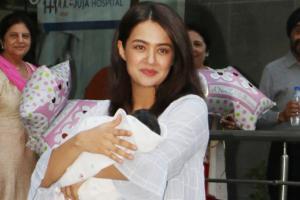 See photos: Surveen Chawla takes her newborn baby girl home