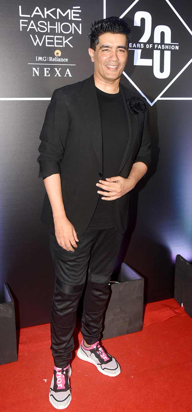Bollywood's very own renowned fashion designer Manish Malhotra kept it odd by sporting funky sneakers with black outfit at the event.