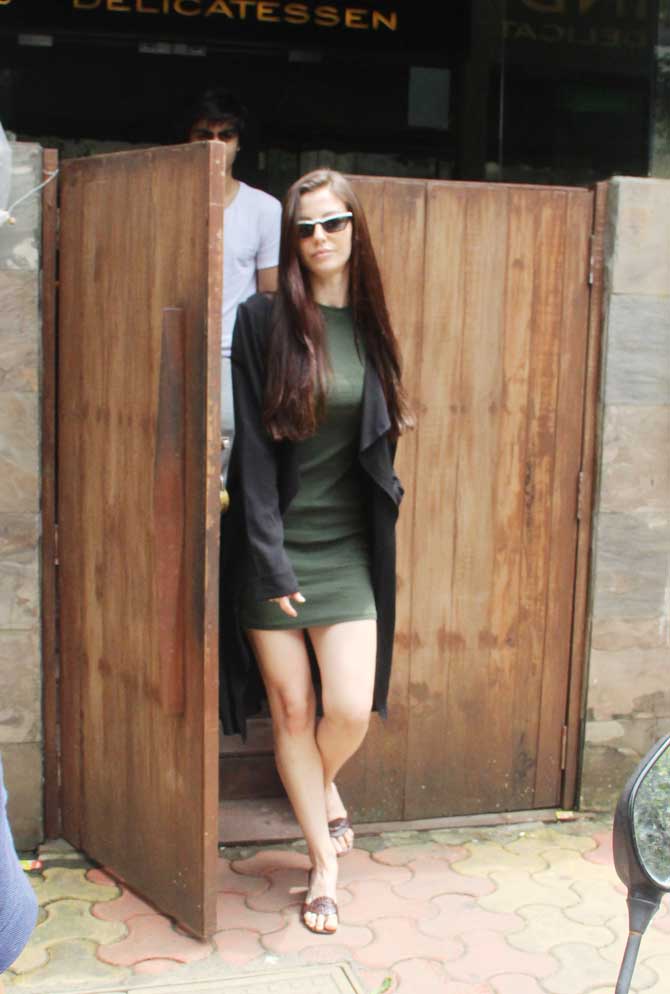 Giorgia Andriani looked pretty in an army green dress she opted for the outing. She completed her casual avatar with a black trench coat and brown coloured sandals when snapped by the shutterbugs in the city.