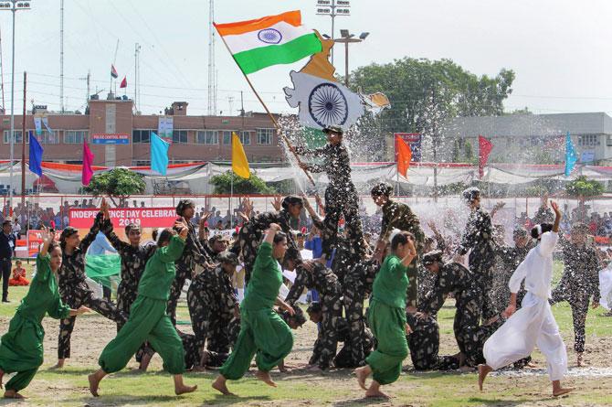 Schoolchildren perform during 73rd Independence Day celebrations at Mini Stadium, in Jammu