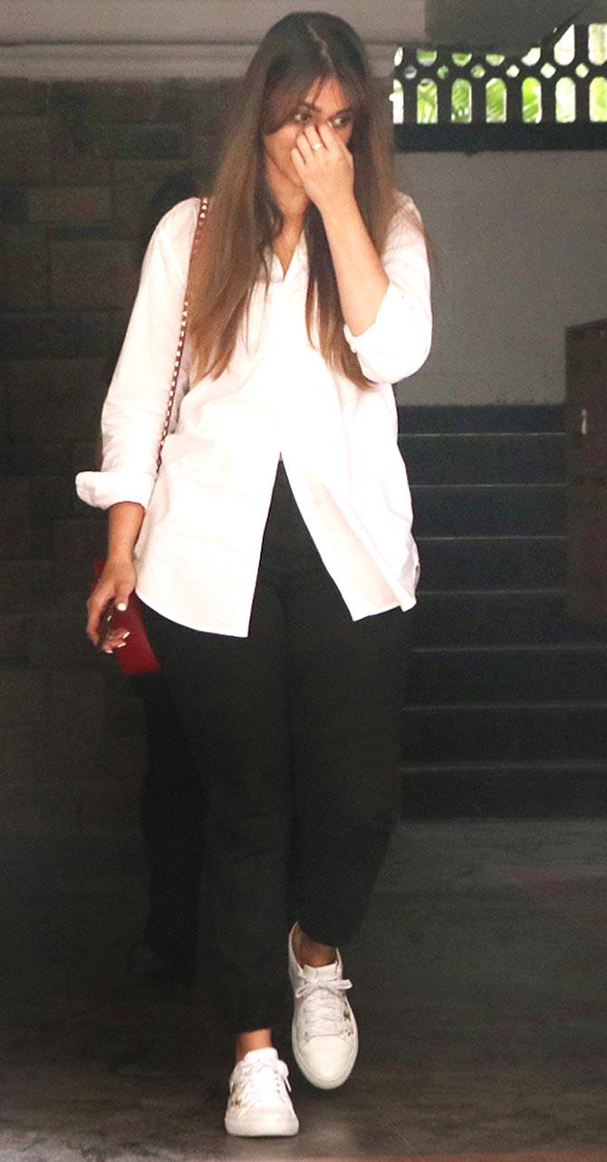 Ileana D'Cruz was clicked by paparazzi in Juhu, Mumbai. Ileana kept it simple in a white tee and black denim for her outing. All pictures/Yogen Shah