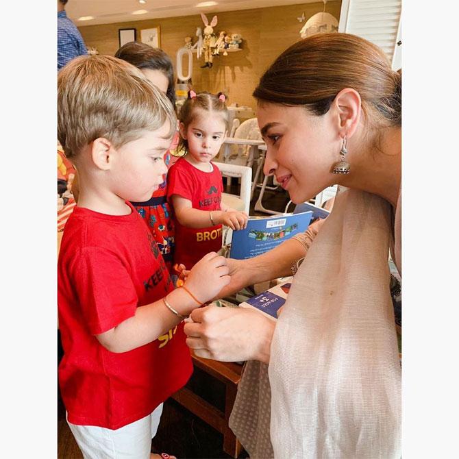 Alia Bhatt tied a rakhi on the tiny wrist of filmmaker Karan Johar's son Yash. The actress took to Instagram to share this picture, where she is seen tying a rakhi to her baby brother Yash Johar. Alia captioned the picture - Just too much love. Well, Alia, we can totally see that! [sic]
