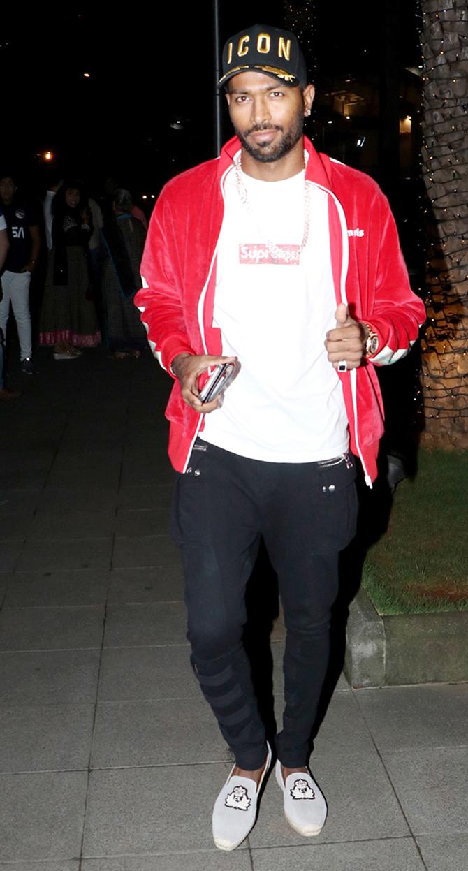 For this outing, Hardik Pandya wore a white t-shirt accompanied by a red jacket, black pants and grey shoes. Hardik Pandya completed his look with a cap which had 'ICON' written on it.