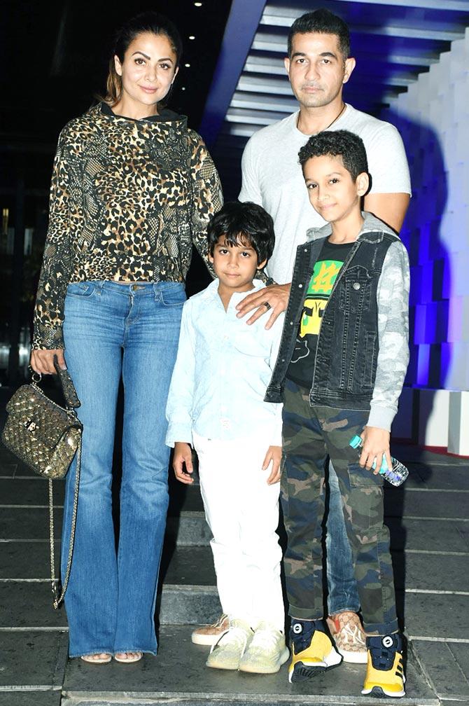 Amrita Arora opted for an animal print top, paired with blue bell-bottom jeans. While the former actress kept it stylish, her husband (like most of the times) opted for a simple outfit.
