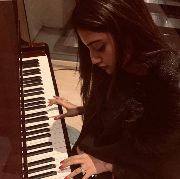 Nusrat Jahan shines in an all-black attire as she shows her fans an unknown and unseen side of her which loves music to the core.
In picture: Nusrat Jahan is seen playing the keyboard as she captions this one: Music has a life.. which is why our hearts have beats..!!!