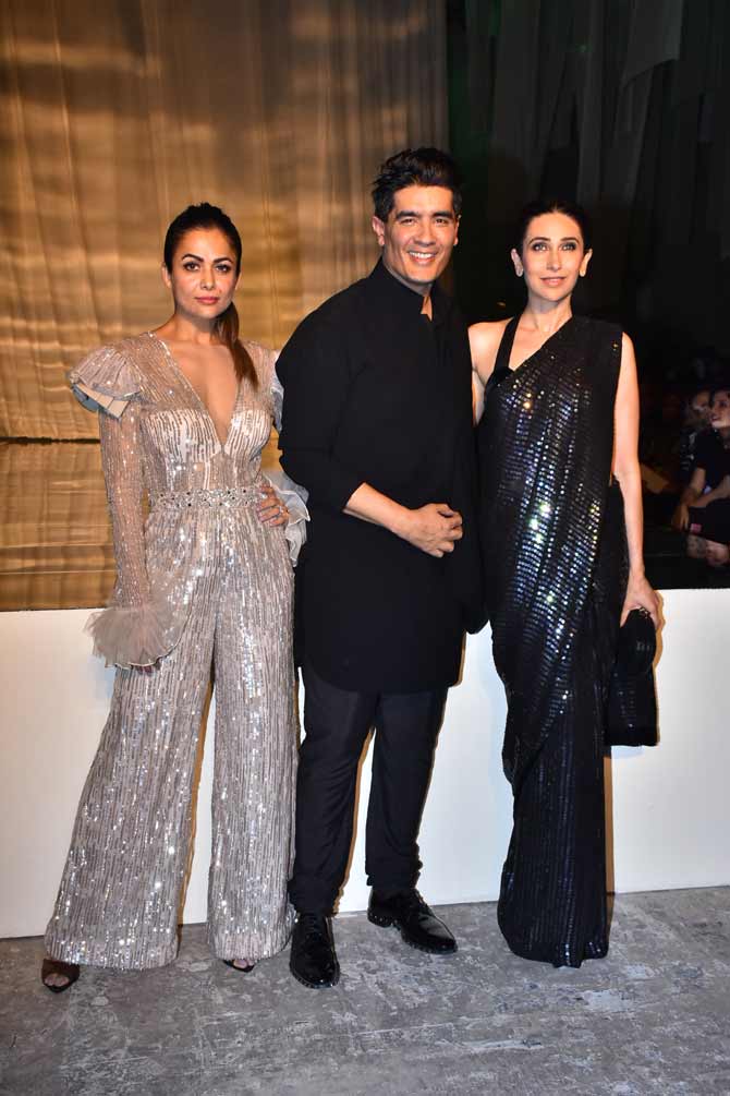 Manish Malhotra, Amrita Arora and Karisma Kapoor posed for the shutterbugs at the event before the show started. Day 1 of Lakme Fashion Week Winter/Festive saw some popular celebrities attending the event.