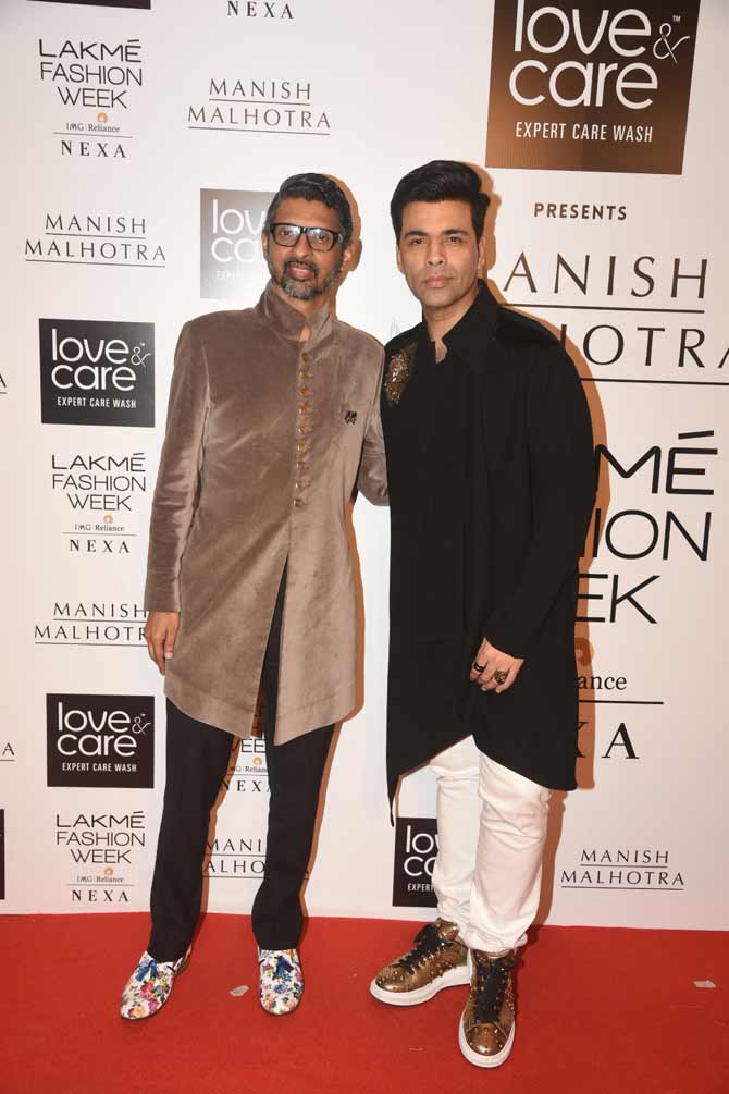 The latest collection of Manish Malhotra has been crafted for lighter occasions as well as destination weddings. The colours ranged from white, ivory, beige, ochre, grey, salmon and the signature gold of the label.
In picture: Karan Johar with Niranjan Iyengar at the Lakme Fashion Week Winter/Festive in the city.