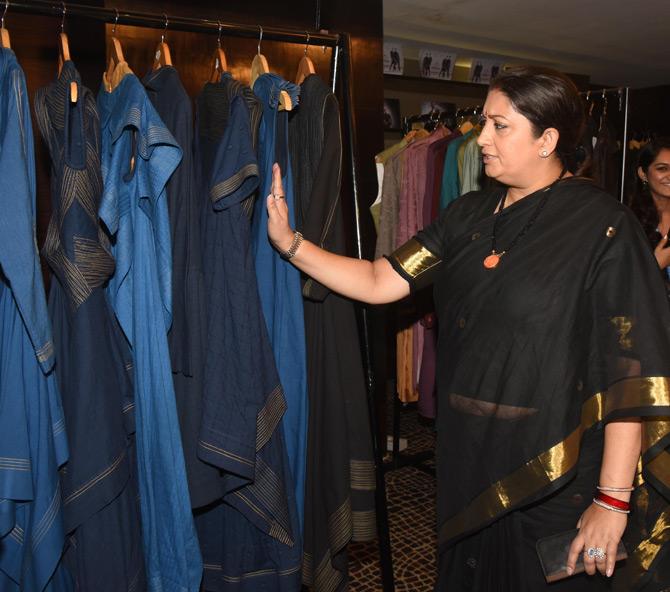 In picture: Smriti Irani walks through some of the collection which were on display by young designers at the Lakme Fashion Week 2019.