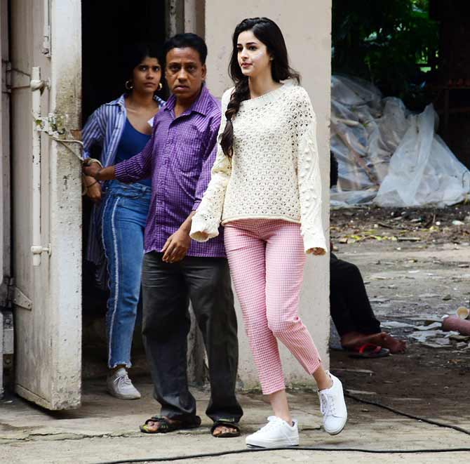 Ananya Panday was clicked at a studio in Bandra, Mumbai. The actress looked casual and pretty in a pair of pink trousers and a white knit jumper.