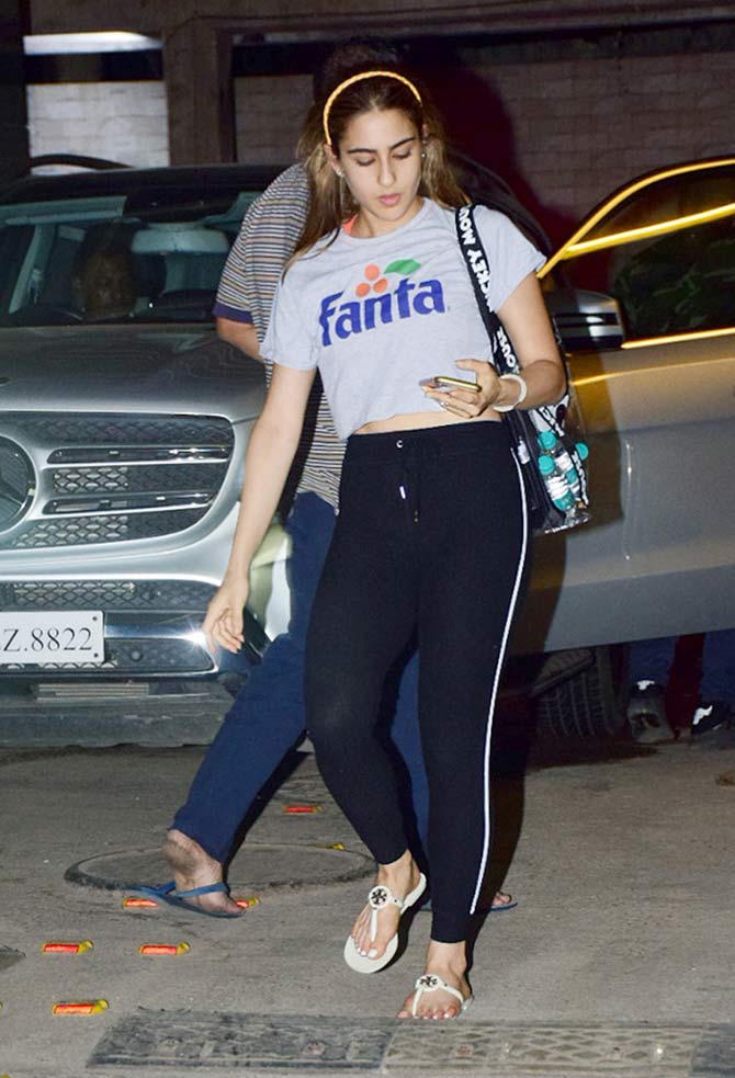 Sara Ali Khan and Varun Dhawan were spotted at a dance studio in Andheri, Mumbai. The duo, who will be next seen in Coolie No. 1, is rehearsing for a song in their upcoming comedy-drama. All pictures/Yogen Shah
