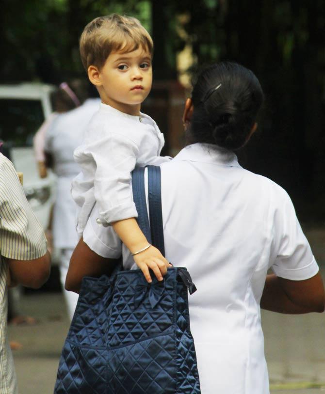 While Roohi Johar was looking all lost when snapped by the shutterbugs, Yash Johar posed for the cameras when clicked at Misha Kapoor's birthday bash in Juhu.