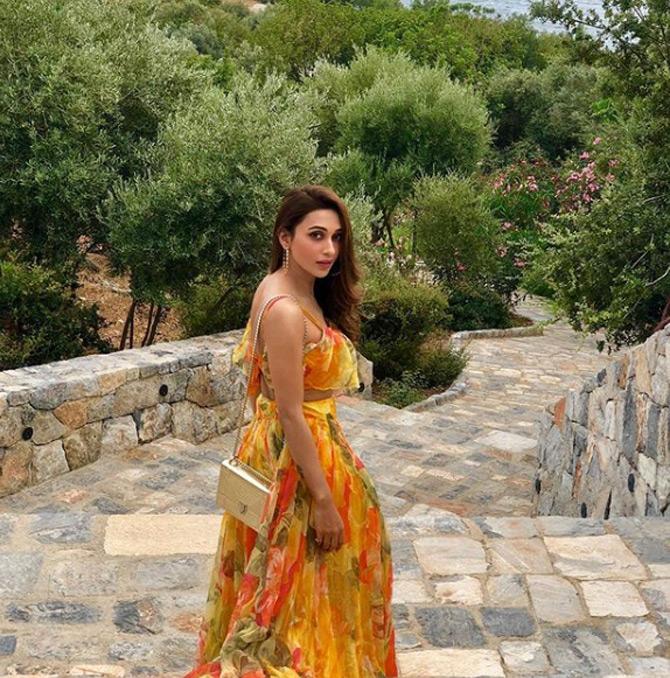 While attending friend Nusrat Jahan's exotic wedding in the Turkish town of Bodrum, Mimi Chakraborty was seen sporting a top and lehenga skirt in hues of yellow with floral prints on it. While sharing this picture, Mimi captioned it: The NJ affair. All set!