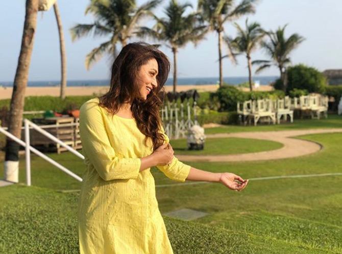 Mimi Chakraborty looks simple and elegant in a 3/4 sleeve yellow Kurti as she soaks in the sun. In the photo, Mimi is seen leaving her long hair open as she is caught in a candid moment.