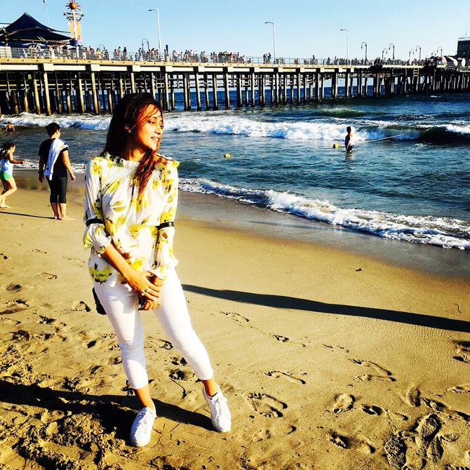 Sharing a leaf out of her exotic vacations to picturesque beaches of California, USA, Mimi Chakraborty is seen shining bright in hues of yellow and white. While sharing this picture, Mimi captioned it: Shoring high in life!
