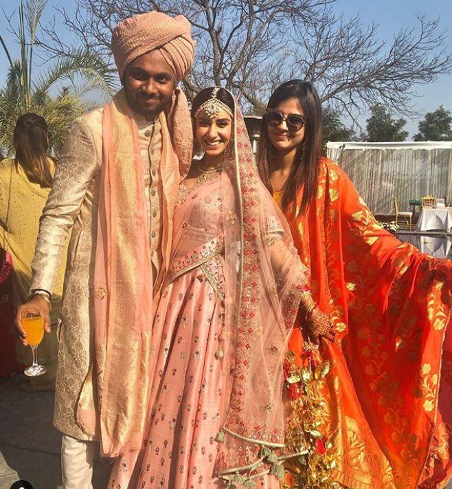 In picture: Sakshi Dhoni strikes a pose with friends in a beautiful yellow and orange lehenga along with a pair of sunglasses on a sunny day. 