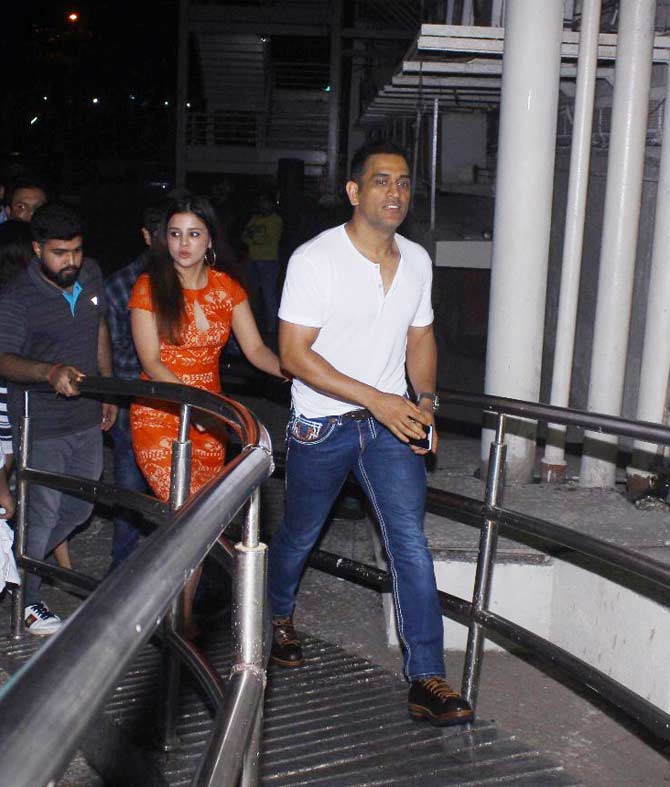 In picture:  Former skipper Mahendra Singh Dhoni and wife  Sakshi during the special screening of Race 3 in Mumbai. 
