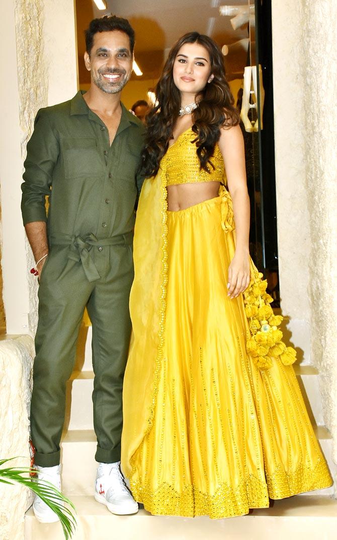Tara Sutaria wore a sunny yellow lehenga set that made the actress look drop-dead gorgeous. She also posed with designer Punit Balana at the store launch in the city.