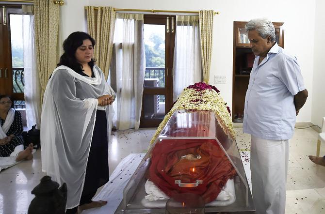 In pic: Sushma Swaraj's husband Swaraj Kaushal and daughter Bansuri Swaraj stand beside the mortal remains of the late Sushma Swaraj at their residence in New Delhi.