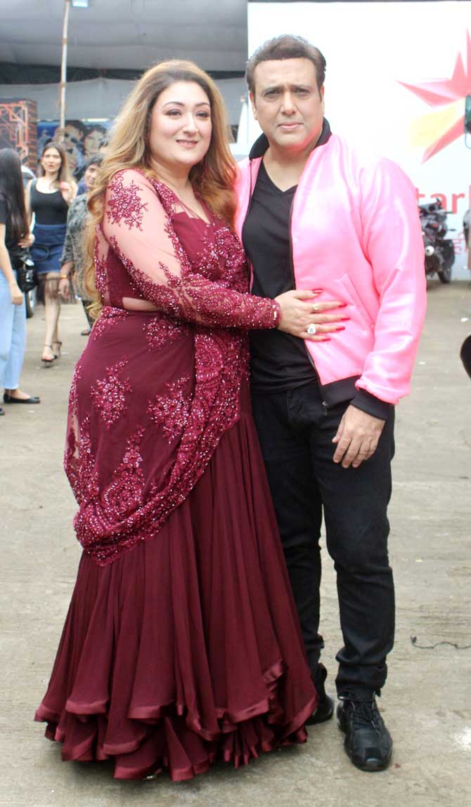 Govinda and his wife Sunita Ahuja made an appearance on the sets of 9th season of dance reality show Nach Baliye as special guests. The popular 90s actor looked dapper in his black t-shirt, black pants, and pink jacket, while his wife looked beautiful in a crimson red saree. All Pictures/Yogen Shah and Datta Kumbhar