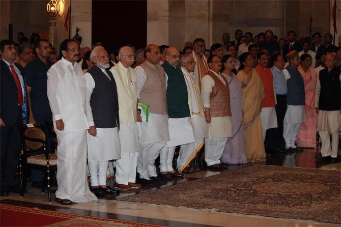 In pic: Vice President M Venkaikah Naidu, Prime Minister Narendra Modi, Senior BJP leader LK Advani, Defence Minister Rajnath Singh, Home Minister Amit Shah, and other cabinet leaders stand for the national anthem.
