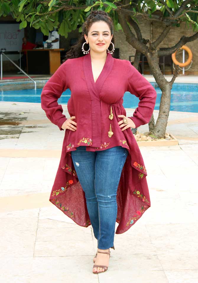 South actress Nithya Menen, who is making her Bollywood debut with Mission Mangal, wore an asymmetrical top and denim for the promotional event. The actress also shared her character poster from the film and wrote, 