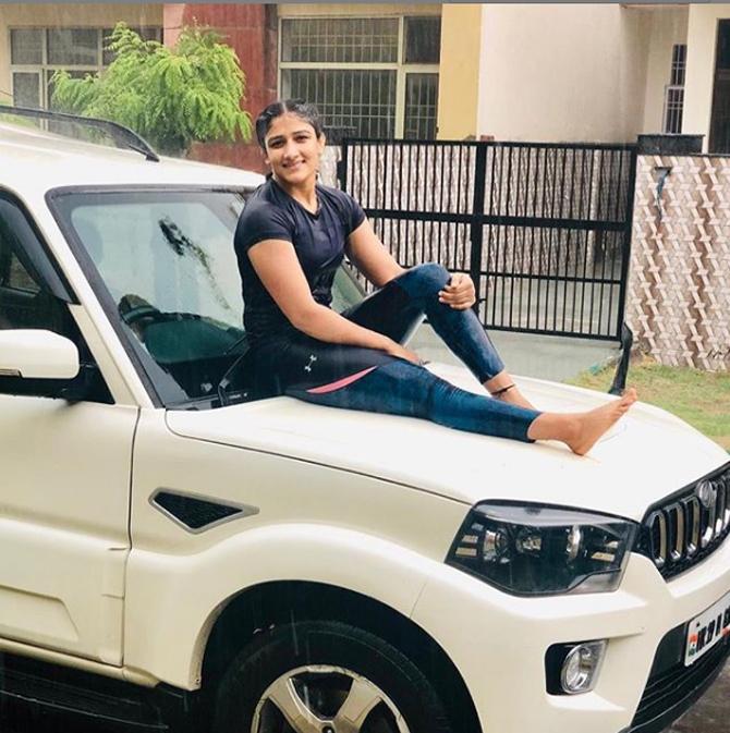 Sangeeta Phogat posted this picture where she is sitting on the bonnet of her car while enjoying the rains.