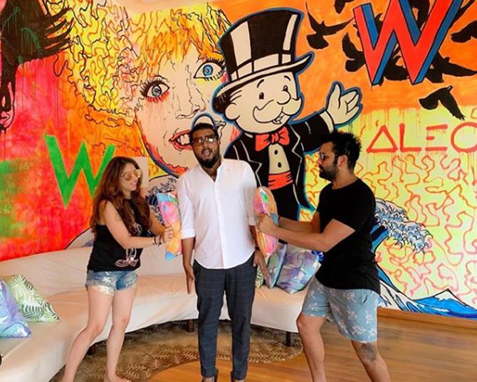 Rohit Sharma and Ritika Sajdeh in a candid moment along with their friend during their holiday in Maldives.
