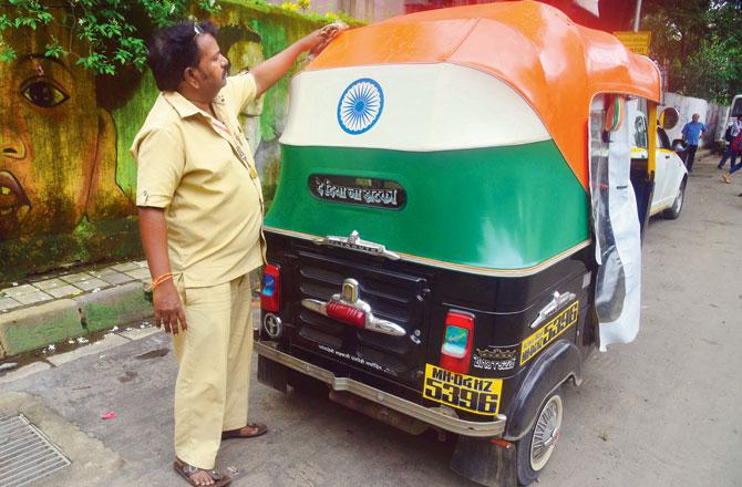 Arjun Jagate with his auto rickshaw. Pic/Atul Kamble