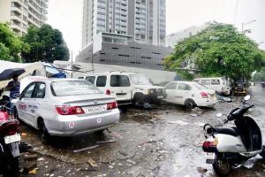 Mumbai: Illegal parking by service centres on footpaths ignored by BMC