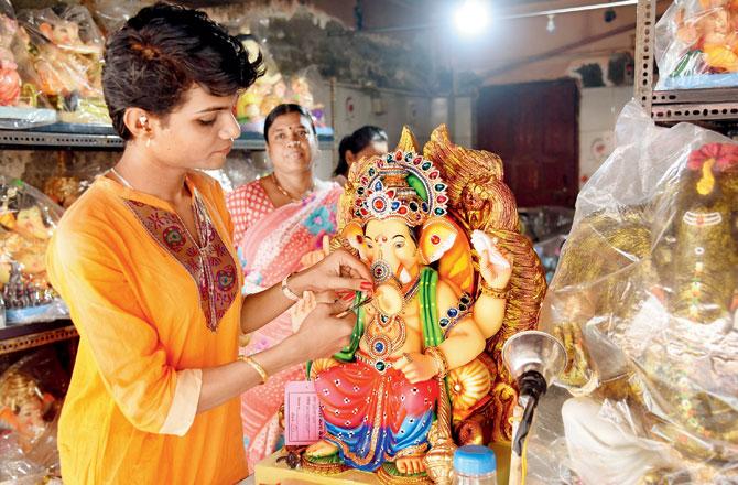 Tarana is saving up for breast implants by making jewellery at a Ganesh idol workshop