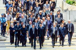 Hong Kong lawyers march in silence to support protesters