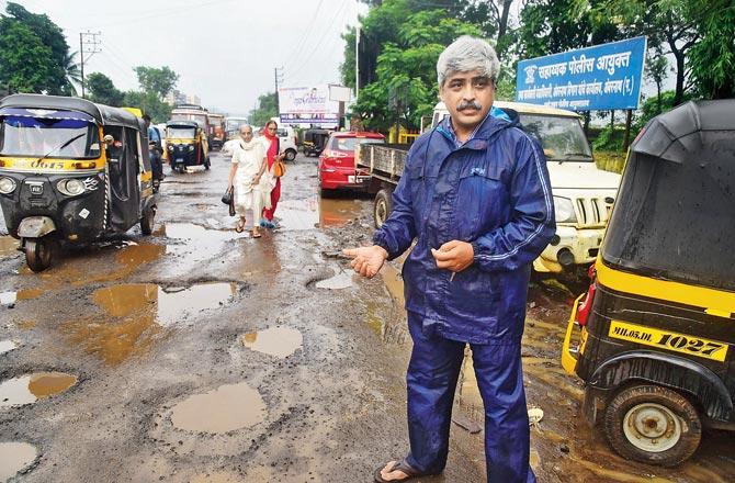 Satyajeet Burman, a resident of the area, says there is not a spot on the entire stretch of road in Amberbath where the traffic copy died, that has no potholes. Pic/Atul Kamble