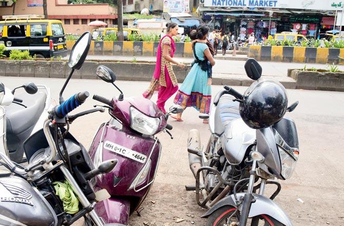 The TVS Jupiter scooter wrongly parker on R A Kidwai Marg
