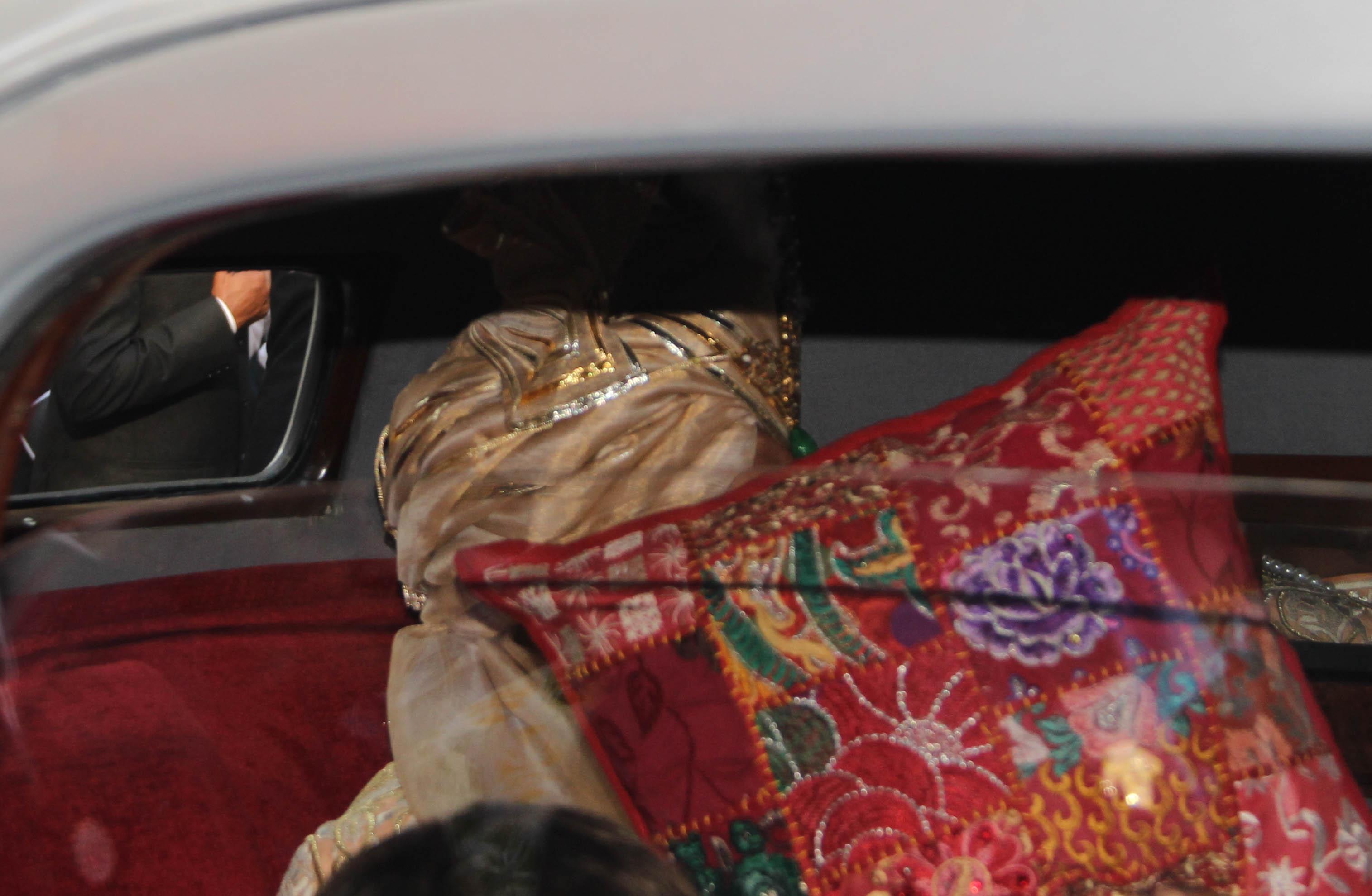 In photo: Anand Piramal covers his face with a pillow as the paparazzi try to get a glimpse of him.