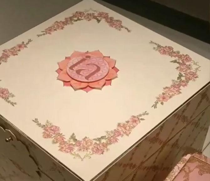 Isha Ambani's wedding invitation was placed inside an elaborately designed storage box with their initials 'IA' etched on the top of it. The box comprised of a diary that contained the wedding invites. The diary had a letter written by Isha and her to-be husband Anand Piramal. What's more? Further pages of the diary revealed the itinerary of the wedding functions with 'Shubh Abhinandan' written on them. The invite contained another box, which was pink in colour with golden embroidery. When opened, one can hear the tune of the Gayatri Mantra. It contained four small boxes with a framed picture of Goddess Gayatri.