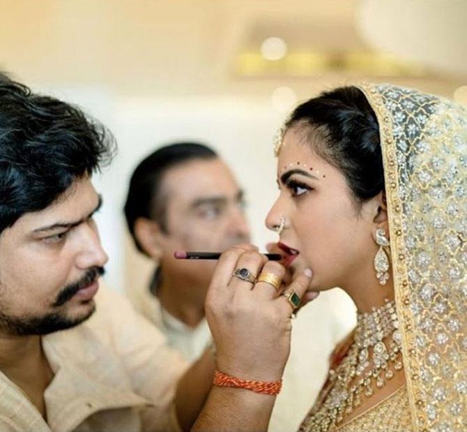 This picture shared by the Isha Ambani's make-up artist, Vardan Nayak, the bride Isha looked all decked up for her wedding day. Isha looked ethereal as she got her make-up done before tying the knot. One can also spot Isha's father Mukesh Ambani in the background.