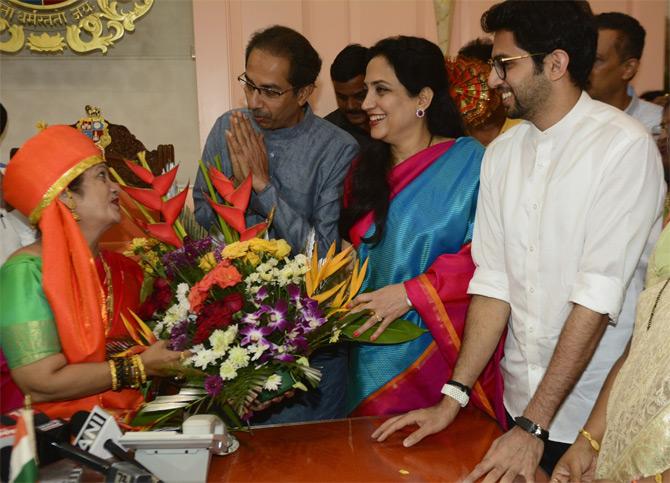 In photo: Shiv Sena chief Uddhav Thackeray and his wife Rashmi Thackeray share a light moment with Mumbai Mayor Kishori Pednekar as son Aaditya Thackeray looks on