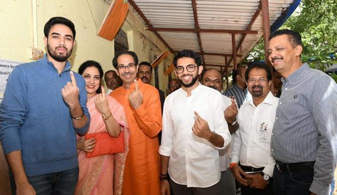 In photo: Uddhav and Rashmi Thackeray with their sons, Aaditya and Tejas pose for the lenses after casting their vote in the state assembly elections