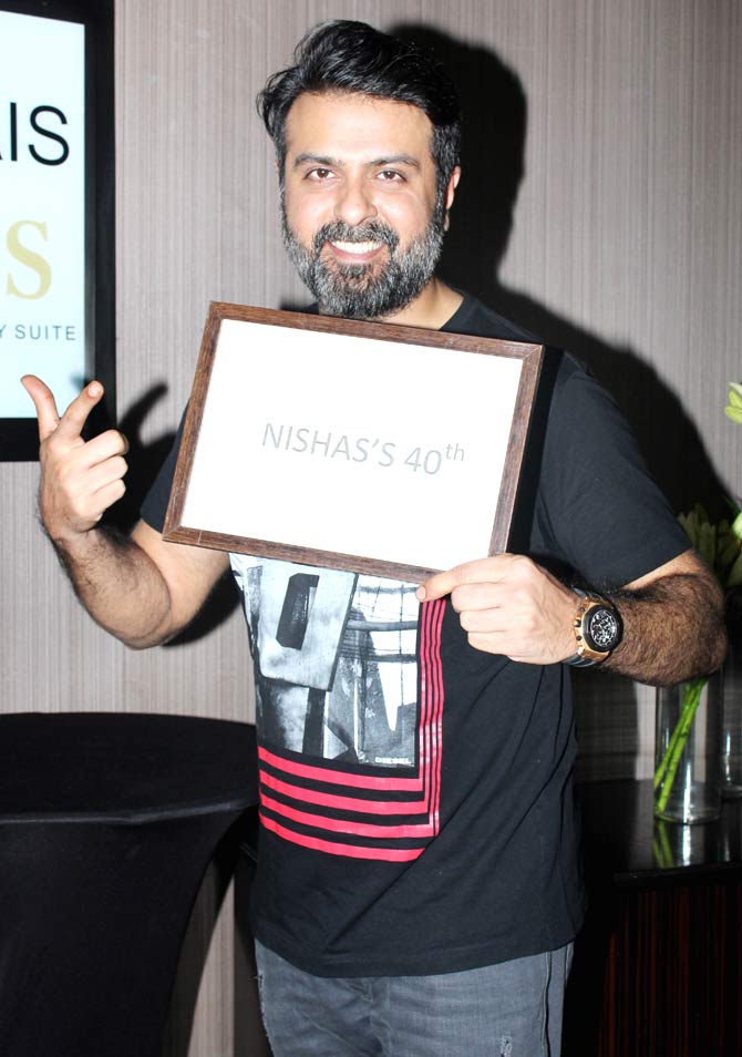 Harman Baweja was all smile as he posed for the photographers at Nisha's 40th birthday party in Lower Parel.