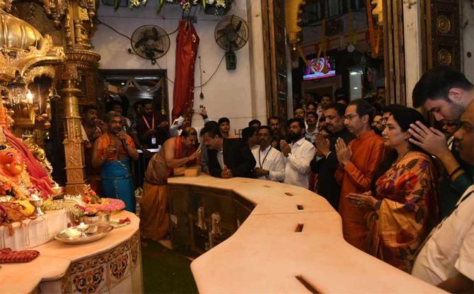 In picture: Shiv Sena chief Uddhav Thackeray with his wife Rashmi and their sons Aaditya and Tejas Thackeray offer prayers at Siddhivinayak temple in Mumbai