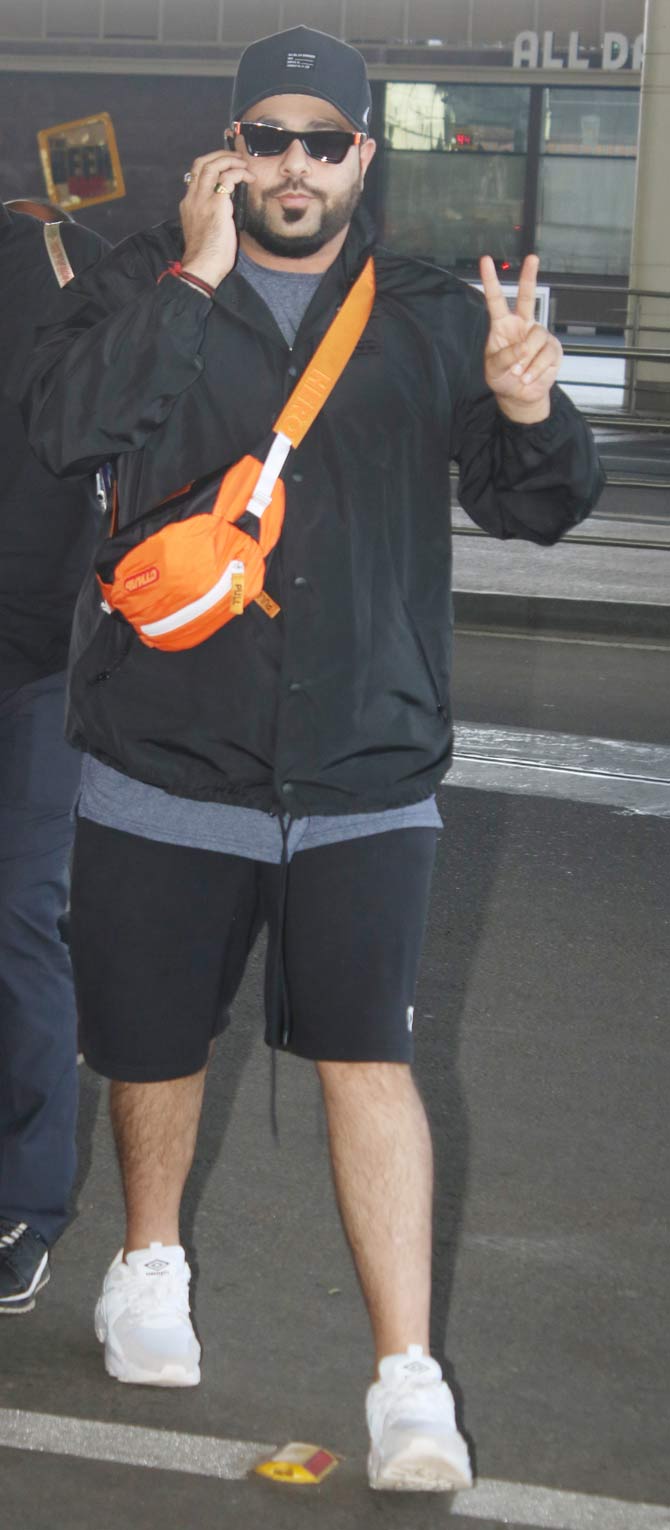 Badshah was also clicked at the airport. The rapper opted for a blue t-shirt, black jacket and shorts for the outing. He teamed up his outfit with a pair of white sneakers, black sunglasses, and a blue cap.