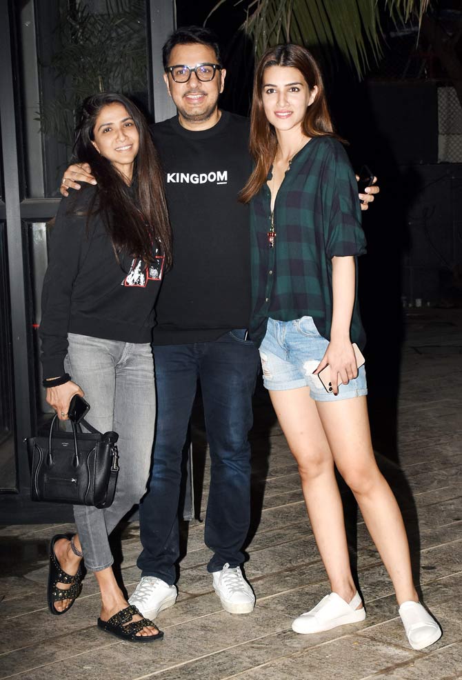 Kriti Sanon, who has done multiple films like Raabta, Luka Chuppi, Arjun Patiala with Dinesh Vijan also attended the producer's party at his residence in Mumbai. 
In picture: Dinesh Vijan with wife Pramita Tanwar and Kriti Sanon pose for the photographers.