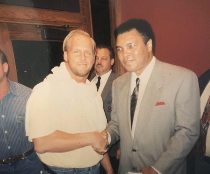 Stone Cold Steve Austin is the only WWE superstar to win the Royal Rumble thrice. He won it in 1997, 1998 and 2001.
Stone Cold Steve Austin in a throwback picture with the late Muhammad Ali. Austin captioned the photo: Here's a classic from way back when I met the GOAT Muhammad Ali. #tbt #stunningsteve #floatlikeabutterflystinglikeabee