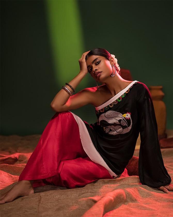 Archana gives festive fashion goals in this black off-shoulder kurti and orange palazzo by the House of Masaba.