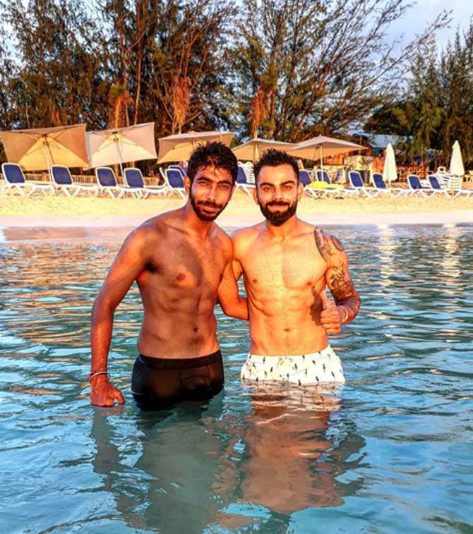 Pacer Jasprit Bumrah shared a cool photo of himself chilling with Virat Kohli on a beach. Bumrah wrote. 'Sun soaking with @virat.kohli and the team'