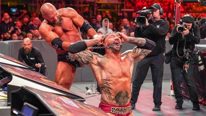Triple H defeated his former Evolution teammate Batista in a gruesome No Holds Barred match. Batista then retired from WWE and wrestling.
